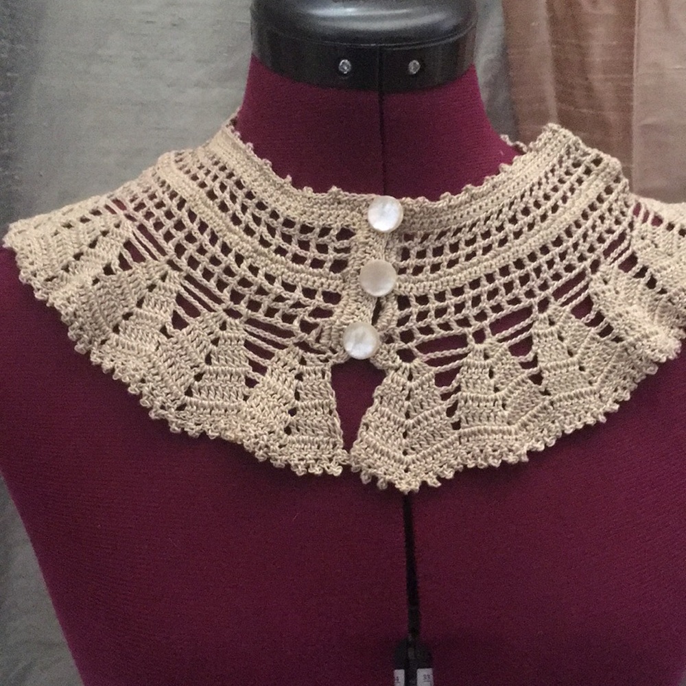 Knitted  or crochet collar with pearl buttons, this is hand made.
